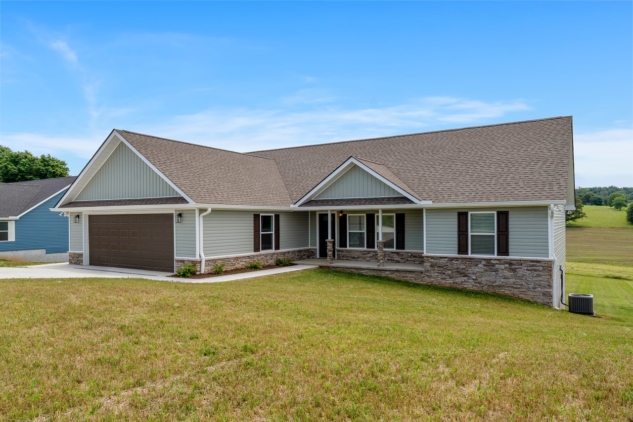 front right  front porch view, concrete driveway, stone foundation