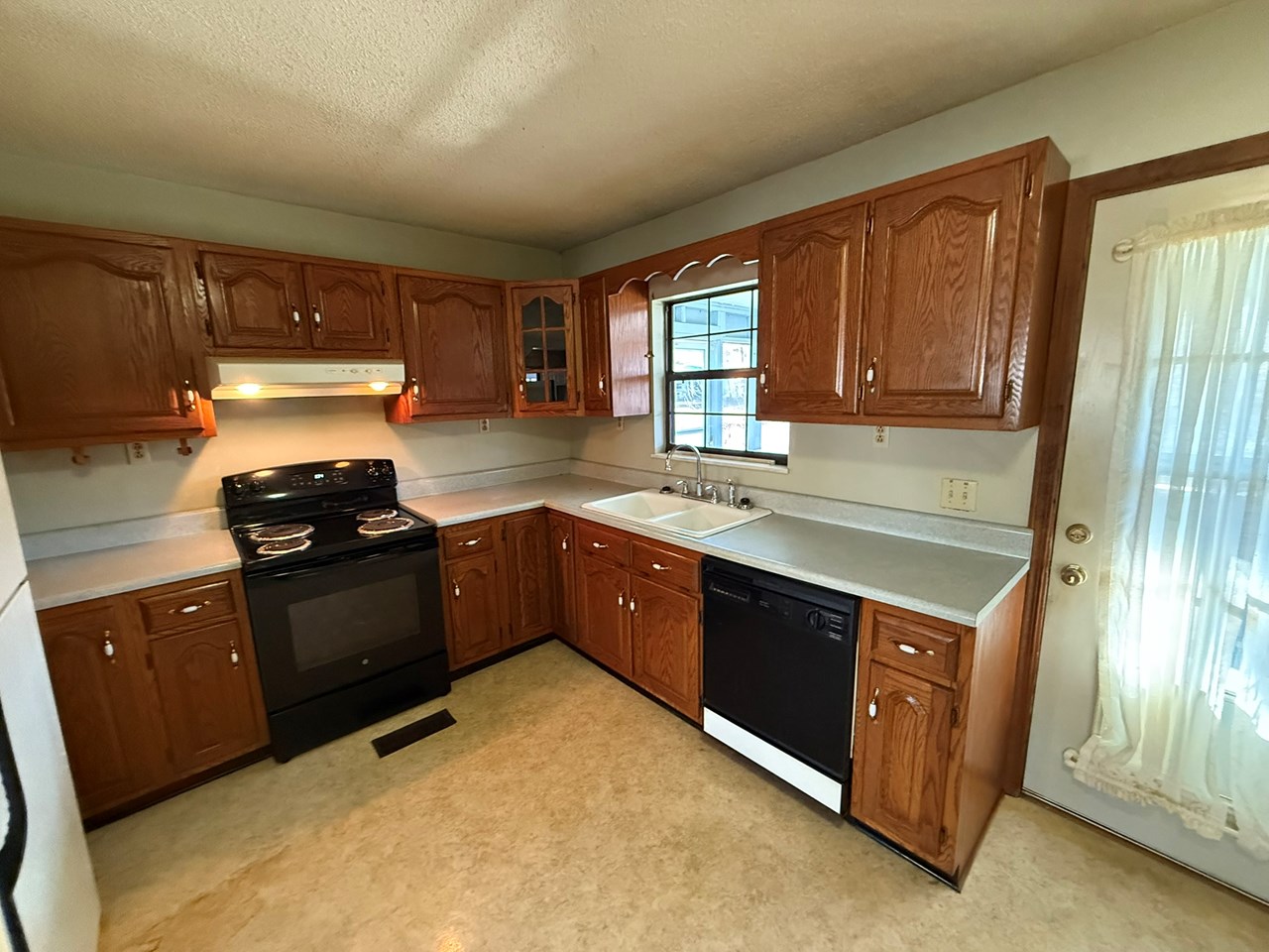 kitchen range oven, cabinets and countertops